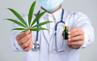 a doctor holding a green leaf and a dropper, Medical marijuana has garnered much attention in recent years, offering a new avenue for health and wellness. However, the benefits of consulting a cannabis doctor are particularly noteworthy, especially in states like Oklahoma, where its use is legalized. Explore these benefits to ensure you get the most out of your first consultation.